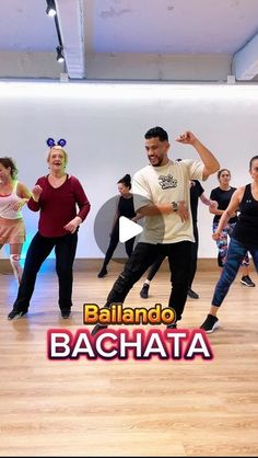 a group of people dancing in a dance studio with the words, bailando bachata