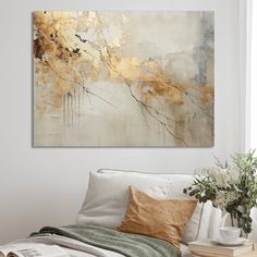 an abstract painting hangs on the wall above a bed with white sheets and pillows, next to a vase filled with flowers