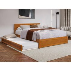 a bed with a wooden headboard and foot board sitting on top of a hard wood floor