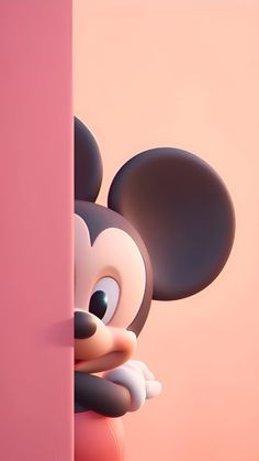 mickey mouse peeking out from behind a pink wall