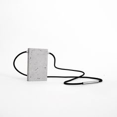 Discover our modern necklace with a rectangular pendant made of cement and hypoallergenic 304 stainless steel. This unique piece is part of the cement jewelry collection designed by Studio Mondocubo for the independent brand ORTOGONALE, known for its innovative and self-produced designs. Inspired by Brutalist and Minimalist styles, the geometric rectangle pendant embodies the essence of modernist architecture, blending raw materials with clean, geometric lines. The exposed cement and stainless s Architectural Necklace, Wearable Architecture, Cement Jewelry, Concrete Necklace, Porcelain Necklace, Concrete Jewelry, Industrial Jewelry, Minimal Necklace, Ceramic Necklace