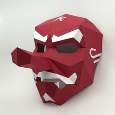 an origami mask made out of red paper