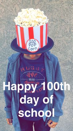 a young boy wearing a top hat with popcorn on it's head and the words happy 100th day of school