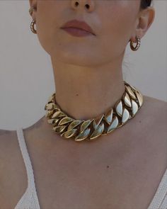 Our favorite statement chain shortened for THAT vibe. Choker measures 16" in length and 1.25" wide - 18k Gold plated Stainless Steel Estimated Ship Date: January 10th Trendy Metal Curb Chain Jewelry, Trendy Cuban Link Chain Jewelry, Party Clavicle Chain Necklace In Yellow Gold, Party Yellow Gold Chain Necklace With Clavicle Chain, Party Yellow Gold Clavicle Chain Necklace, Metal Curb Chain Jewelry, Chic Curb Chain Necklace For Party, Party Cuban Link Chain Necklace With Adjustable Chain, Gold Plated Clavicle Chain Necklace For Party