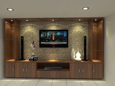 an entertainment center with a flat screen tv mounted on it's wall and two vases in front of it