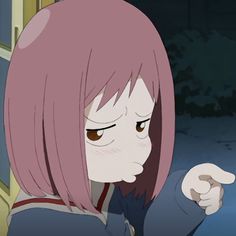 a woman with pink hair pointing at something