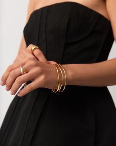 Trio Molten Ripple Bangle Bracelet Set | 18k Gold Vermeil. More is More. Make a Statement with this Standout Bracelet Set, Featuring Three of Our Molten Ripple Bangles. This Delicate Bangle Bracelet Features an Organic-Inspired Shape with Our Signature Molten Wavy Detailing. Stack All Three Together, Balance Out Across Both Wrists, or Wear Solo for Endless Ways to Style. Worth $693, Save $84 When Buying Together. Metal: 18K Recycled Gold Vermeil on Recycled Sterling Silver Small Band Width Varie Small Band, Trending Bracelets, More Is More, Bangle Bracelet Set, Earring Trends, Gold Signet Ring, Diamond Gift, Bangles Style, Festival Jewelry