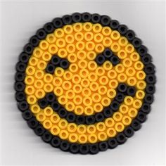 a yellow and black smiley face made out of legos