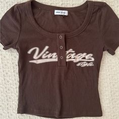 Y2k Brown Baseball Tee From Urban Revival! Never Worn No Flaws New W/O Tags , Size Xs-S Vintage 2000s Outfits, Baseball Tee Outfit, Depop Clothes, Shoes List, Desired Wardrobe, Y2k Graphic Tees, Thrift Board, 2000s Tops, Y2k Shirts