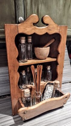 an old wooden shelf with spices and other items