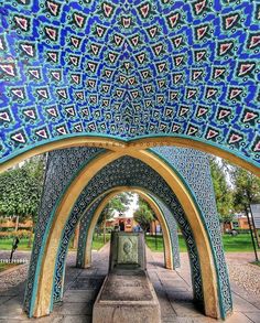 an artistic view of the inside of a building with blue and yellow designs on it