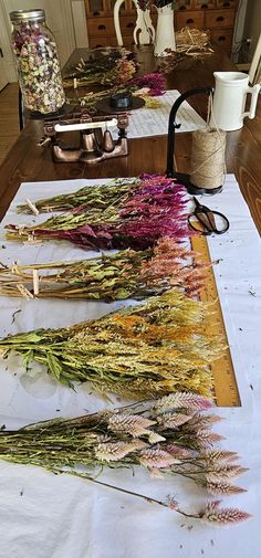 dried flowers are laid out on a table