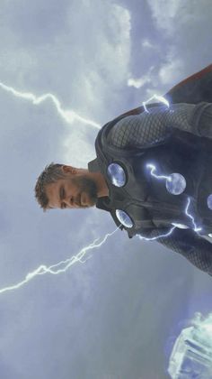 a man in a black suit and lightning bolts