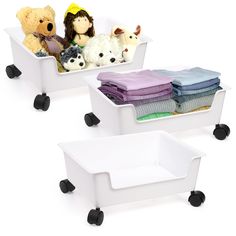 two white storage bins with stuffed animals in them on black wheels and one is filled with folded towels