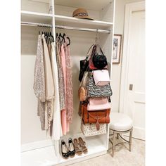 an organized closet with clothes and handbags