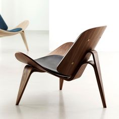 the modern chair is made from wood and leather