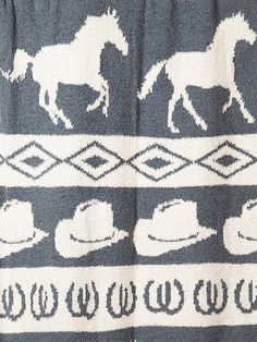 a black and white blanket with horses on it