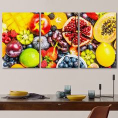 three panels of fruit displayed on a wall