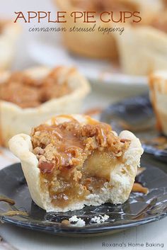 an apple pie cupcake on a black plate