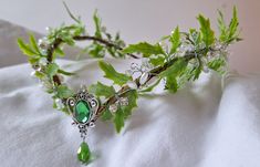 * Introducing our exquisite handmade Elven Princess Forest Crown! This enchanting tiara is adorned with a beautiful green leaf design and features two stunning green stones. Fit for a true forest queen, this crown will add a touch of magic and elegance to any occasion. * Crafted with meticulous attention to detail, our Elven Princess Forest Crown is the perfect accessory for those who love nature and fantasy. The green leaf design symbolizes the beauty and vitality of the forest, while the green Forest Fairy Aesthetic, Forest Crown, Elven Headpiece, Green Headpiece, The Wizard Of Oz Costumes, Woodland Tiara, Hobbit Wedding, Elf Tiara, Woodland Crown