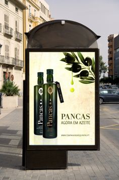 an advertisement for pancas is displayed on the side of a street with buildings in the background