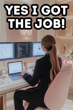 a woman sitting at a desk in front of a computer with the words yes i got the job