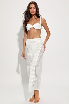 Throw on your best bikini and the 4th & Reckless Arles Ivory Pointelle Side-Tie Sarong Swim Cover-Up for a look that's certain to stun! Sheer, stretchy knit (with a chic, pointelle-inspired pattern throughout) shapes this sultry, sunny sarong that has a flattering fit, with a wrap-style design that ties at the side. Overlapping silhouette continues down to a maxi hem. Fit: This garment fits true to size. Length: Mid-calf length. Size medium Waist: Loosely Fitted. Hip: Loosely Fitted. Fabric: Fab Elegant Strapless Swimwear For Beach, Elegant White Swimwear For Vacation, Beachy White Cover-up For Party, Beachy White Party Cover-up, White Vacation Party Swimwear, Elegant Bandeau Swimwear For Beach, Elegant White Swimwear For Beach, Elegant Tie-side Swimwear For Beach Season, Elegant White Swimwear For Beach Season