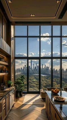 the kitchen is very large and has many windows to look out on the cityscape