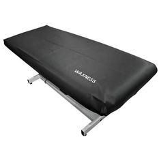 the waxless mattress is sitting on top of a metal frame and has black cover