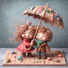 two figurines are holding an umbrella in the rain