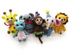 crocheted stuffed animals are arranged in a row