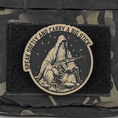 a patch on the back of a camo bag