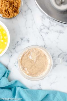 ingredients to make an egg muffin laid out on a marble counter top