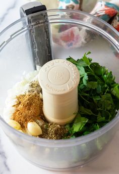 ingredients in a food processor ready to be blended into soup or salad dressing for dinner