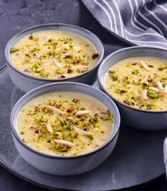 three bowls filled with soup on top of a plate