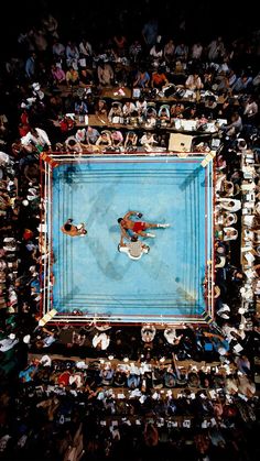 an overhead view of a pool surrounded by people