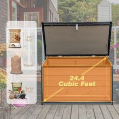 an open trunk sitting on top of a wooden deck next to flowers and potted plants