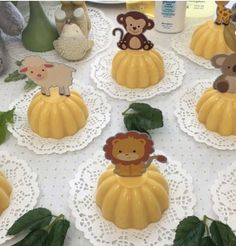 there are many small pumpkins decorated with animals on the top one has a lion, monkey and giraffe