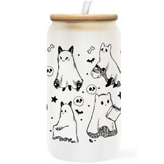 a white canister with black and white illustrations on the side, featuring cats and dogs