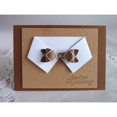 a close up of a greeting card with a bow tie on the front and bottom