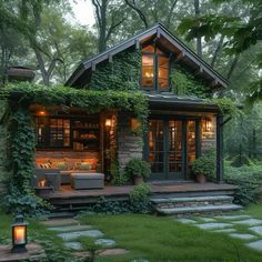 a small house with lots of greenery on the roof