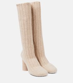 Atomic knitted knee-high sock boots in beige - Bottega Veneta | Mytheresa Knitted Boots, Beige Shoe, Designer Beige Boots For Winter, Luxury Knee-high Winter Boots, Luxury Fitted Beige Boots, Designer Beige Winter Boots, Luxury Beige Winter Boots, Cream Bottega Boots, Beige Ankle-high Boots With Textured Sole