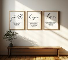 three framed art prints on the wall above a wooden bench with a potted plant