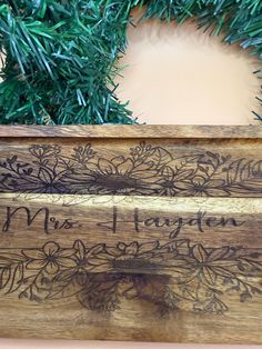 a close up of a wooden box with writing on it