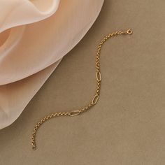 Introducing our 14K Real Solid Gold Paperclip Rolo Chain Bracelet, featuring unique Italian paperclips. This elongated link chain for women is a trending statement bracelet that combines elegance with modern style. Crafted from genuine 14K solid gold, it ensures lasting quality and sophistication. Elevate your accessory collection with our distinctive and fashionable gold bracelet, perfect for any occasion. -- ⋆ This product is designed with Runda's fine handcrafting with sustainable methods. ⋆ Express-insured shipping to the whole world and delivery to cargo in only 3 business days. ⋆ Free return and warranty Product Details * 14K Real Solid Gold * Yellow - White - Rose Gold Available * Available Lengths: 5.5" 6" 6.5" 7" 7.5" 8"  Please contact us for more. * Hypoallergenic * Model No B23 Chain For Women, Gold Armband, Bracelet Dainty, Gold Bracelet For Women, Layered Bracelets, Statement Bracelet, Rolo Chain, Recycled Gold, White Rose Gold