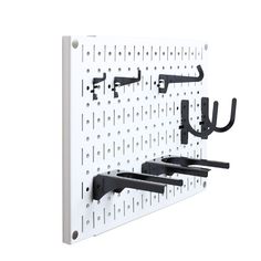 a white wall mounted coat rack with hooks