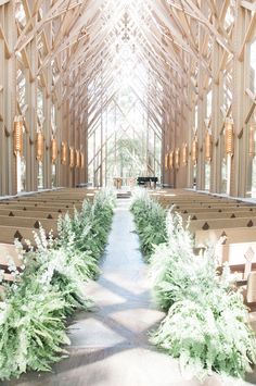 an instagram photo taken by the photographer in front of a church with rows of pews and greenery