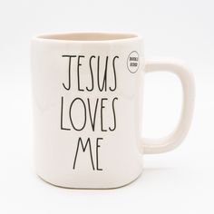 a coffee mug with the words jesus loves me written on it