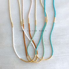 Seed Bead Necklaces for Women, perfect to layer or a fun piece of dainty jewelry to add a little splash of color!  D E T A I L S *Seed beads in your choice of color combination  *Hand strung in a modern pattern *14kt Gold-Filled beads & spring clasp Color combos:  white & beige  rust & blush  seafoam & beige  turquoise & turquoise  LENGTH *16 inches in length or 16 inches with a 2 inch extender  *Choose a 18 inch length or a 18 inch with a 2 inch extender for up to 20 inches. HOW TO PERSONALIZE *Select your choices from the drop down menu to create your custom design. ∙ EXTRA LOVE ∙ Handcrafted just for you in sunny Arizona by a team of talented women. All of our jewelry comes gift packaged! We are happy to leave a note if this is a special gift, just let us know in the message box at chec