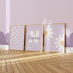 three framed pictures with the word mom on them in front of a pink wall and wooden floor